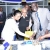 Ag. MD & CEO Eng. Jared Othieno cuts a cake to celebrate Customer Service Week 2019 at Stima Plaza banking hall.